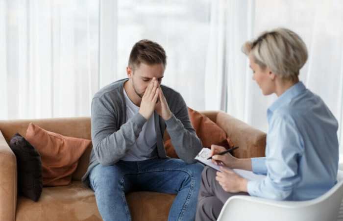 Psychotherapy nigeria psychiatrist concierge counselling madamenoire laying front psychotherapist clipboard